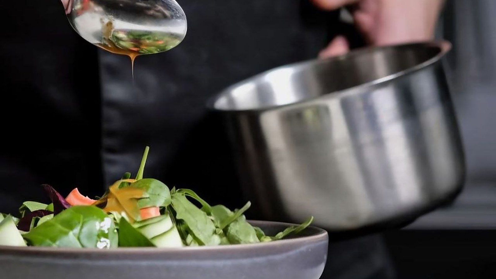 Dressing drizzled over a fresh salad